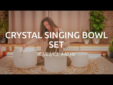 crystal singing bowl being played with a singing bowl mallet to demonstrate clear sustained tones and smooth resonance for meditation and sound therapy