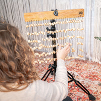 Sound Therapist using a chime mounted on a Meinl Energy Chimes Stand.
